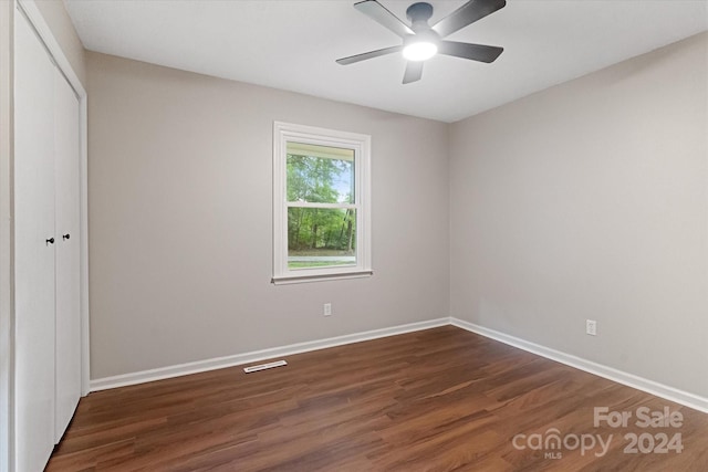 interior space with ceiling fan and dark hardwood / wood-style flooring