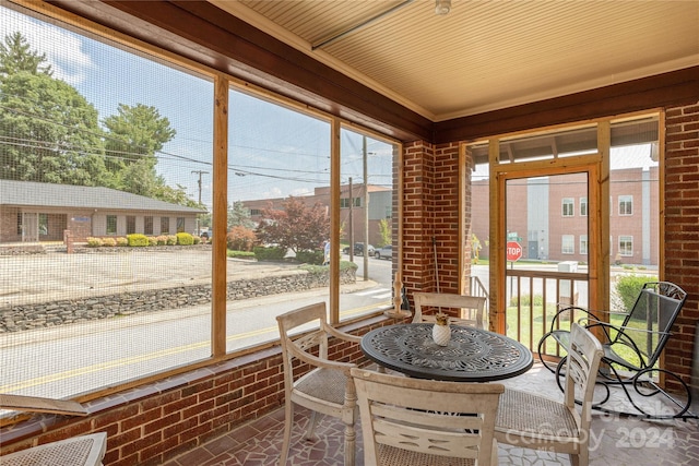 sunroom with wood ceiling