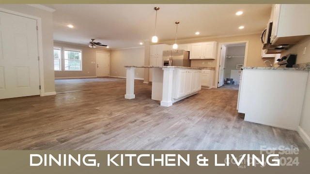 kitchen with white cabinetry, ceiling fan, hanging light fixtures, stainless steel appliances, and light hardwood / wood-style flooring