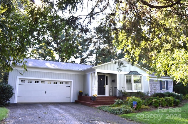 single story home featuring a garage