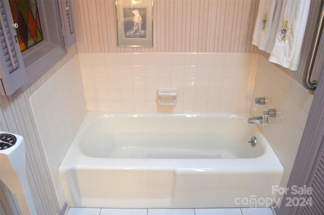 bathroom with tile patterned floors