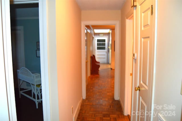 hall with dark parquet flooring