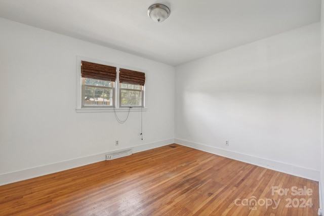 empty room featuring hardwood / wood-style flooring