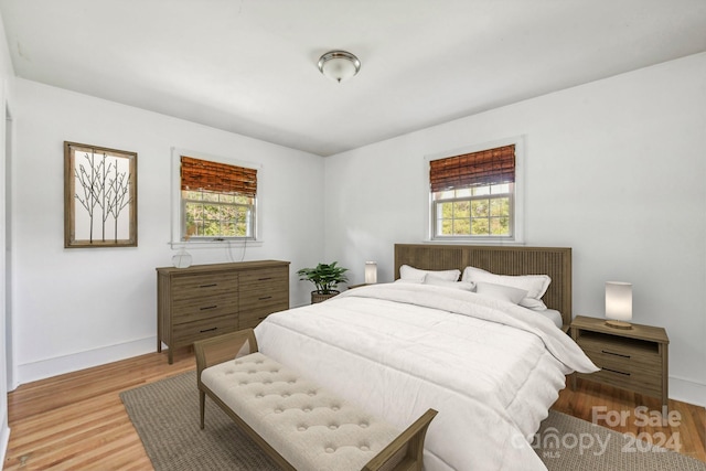 bedroom with hardwood / wood-style flooring