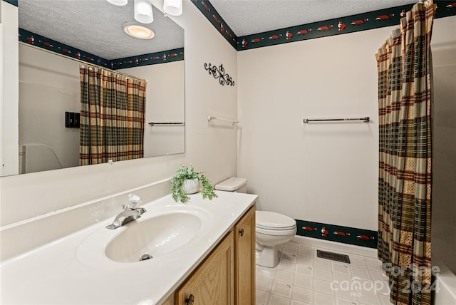 bathroom featuring tile patterned floors, a textured ceiling, a shower with shower curtain, vanity, and toilet