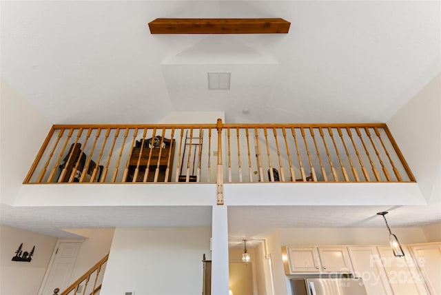 staircase with a towering ceiling