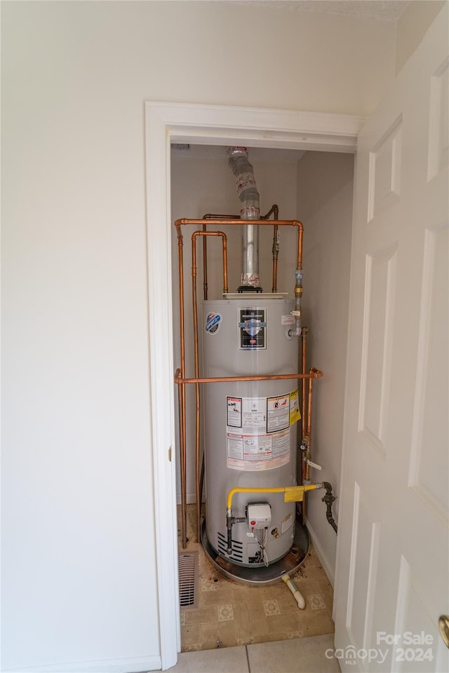 utility room with water heater