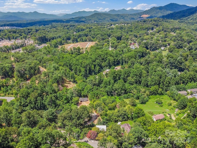 aerial view with a mountain view and a wooded view