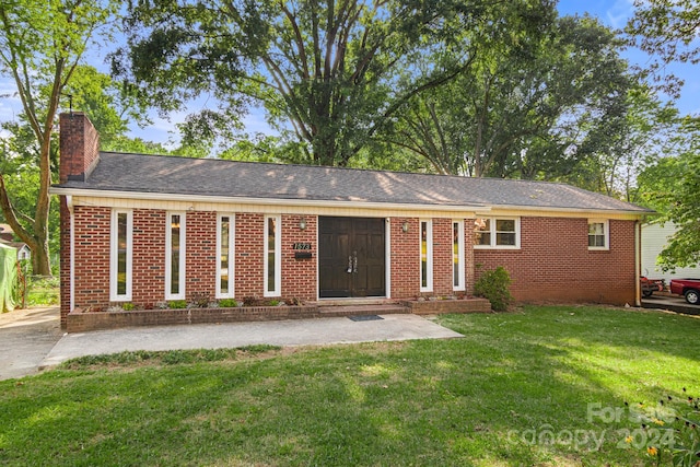 1573 Timberlake Dr, Shelby, NC 28150 - ranch-style home with a front yard, brick siding, and a chimney