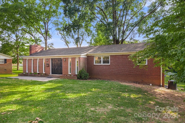 1573 Timberlake Dr, Shelby, NC 28150 - view of front facade with brick siding, a chimney, and a front yard
