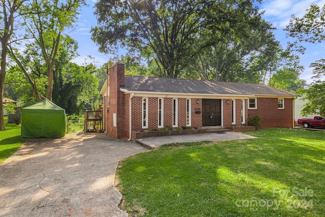 1573 Timberlake Dr, Shelby, NC 28150 - ranch-style home with brick siding, a chimney, concrete driveway, and a front lawn