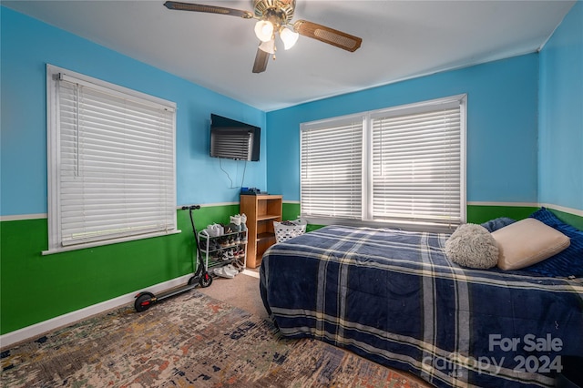 bedroom with ceiling fan and carpet flooring