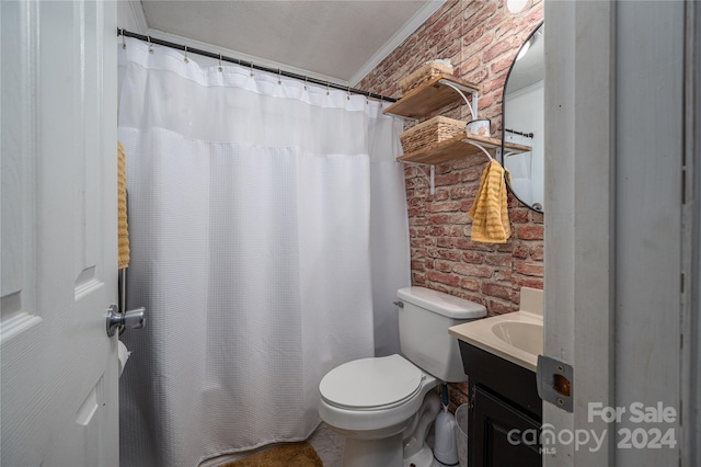 bathroom with toilet, brick wall, ornamental molding, curtained shower, and vanity