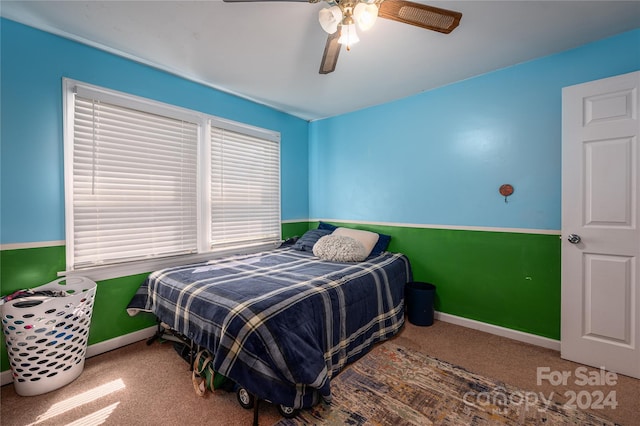 bedroom with ceiling fan and carpet floors