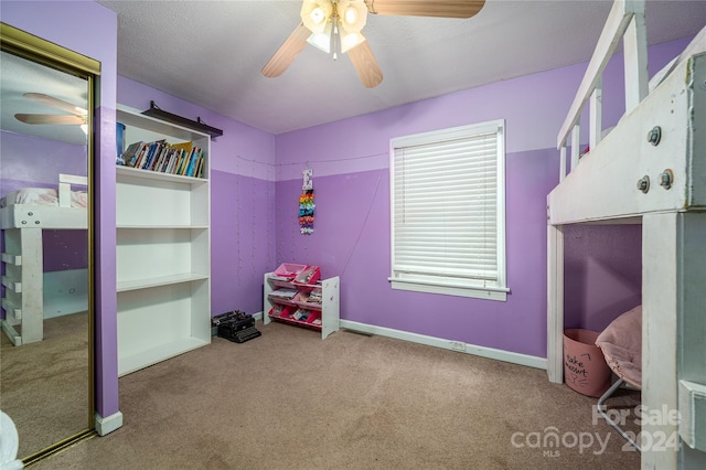 carpeted bedroom featuring ceiling fan