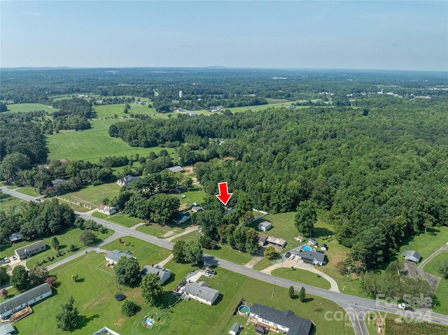 aerial view featuring a view of trees