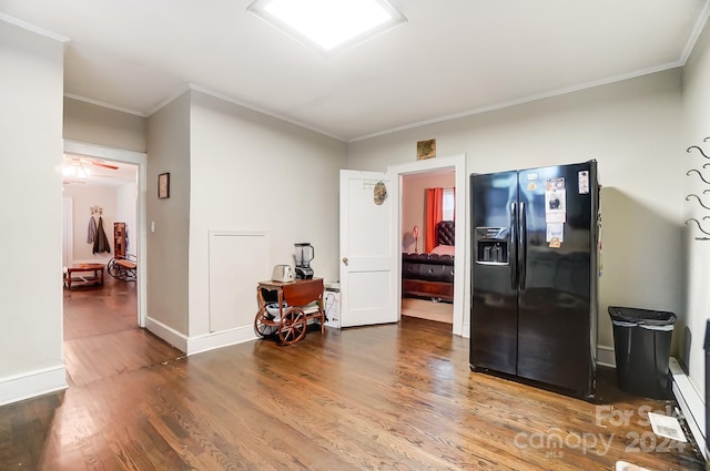 interior space with ceiling fan, hardwood / wood-style flooring, and ornamental molding