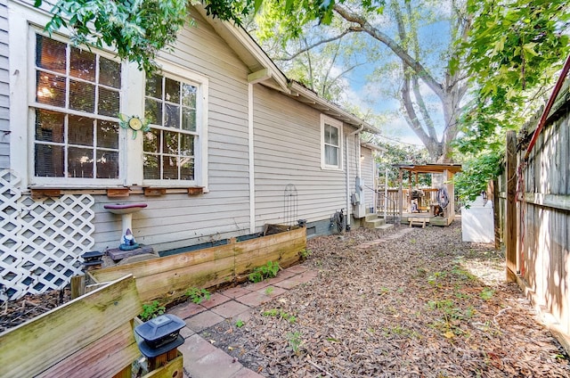 view of side of home featuring a deck