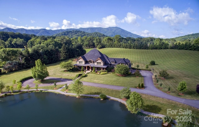 drone / aerial view featuring a mountain view and a rural view