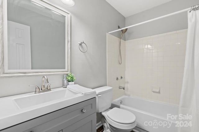 full bathroom with shower / bath combination with curtain, vanity, and toilet