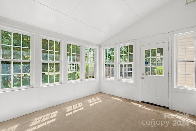 unfurnished sunroom with lofted ceiling