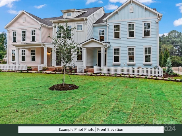 view of front facade with covered porch and a front yard