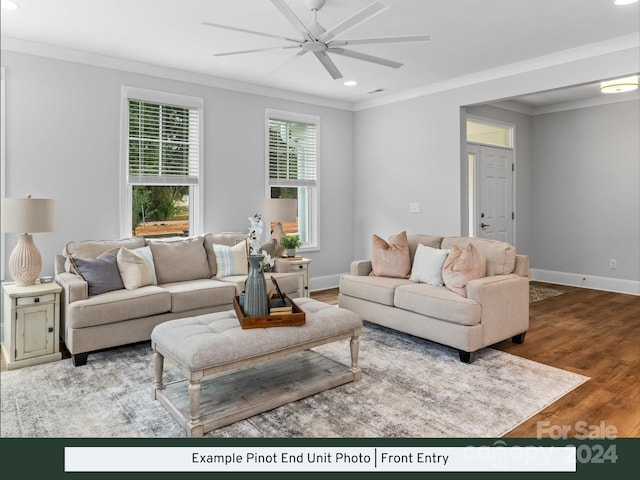 living room featuring ceiling fan, hardwood / wood-style flooring, and ornamental molding