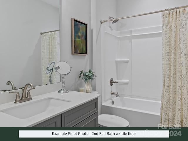 full bathroom with shower / tub combo with curtain, vanity, and toilet