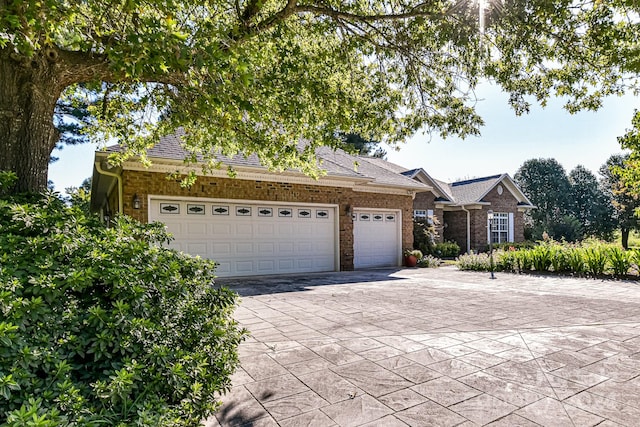 ranch-style house featuring a garage