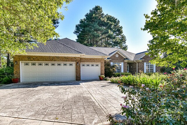 single story home featuring a garage