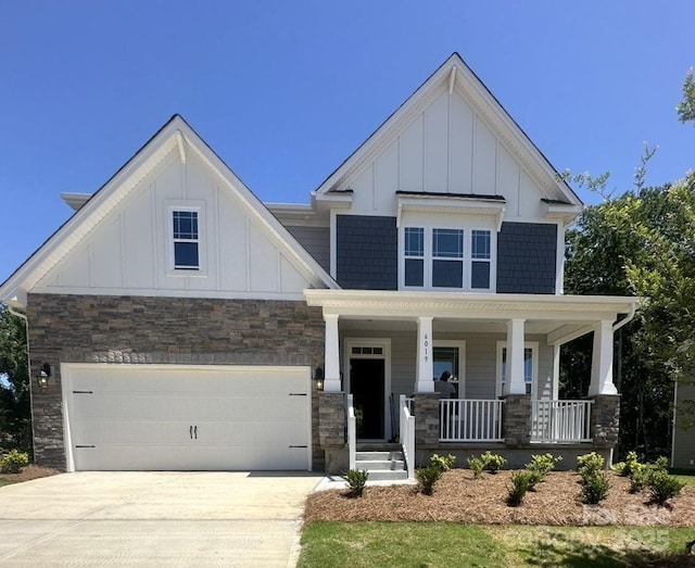 craftsman house with a garage and a porch