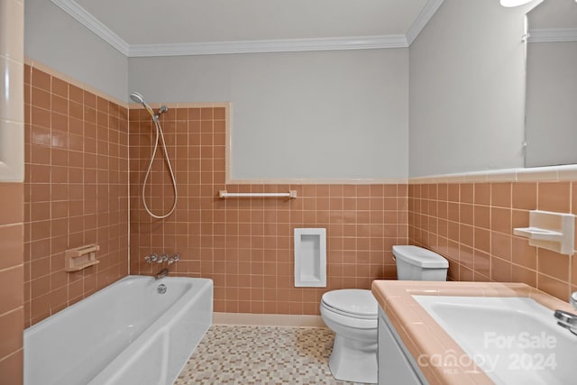 full bathroom featuring toilet, tile patterned flooring, tiled shower / bath, vanity, and tile walls