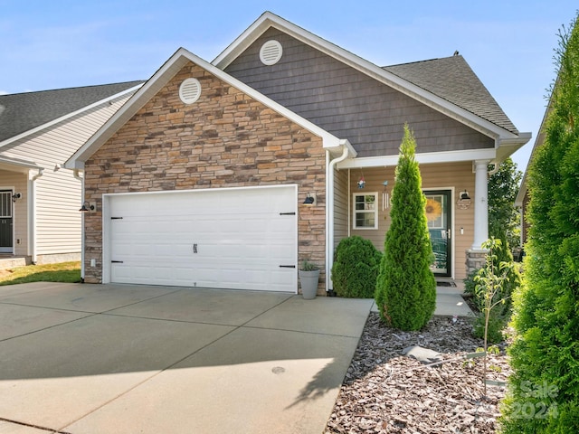 craftsman-style home featuring a garage