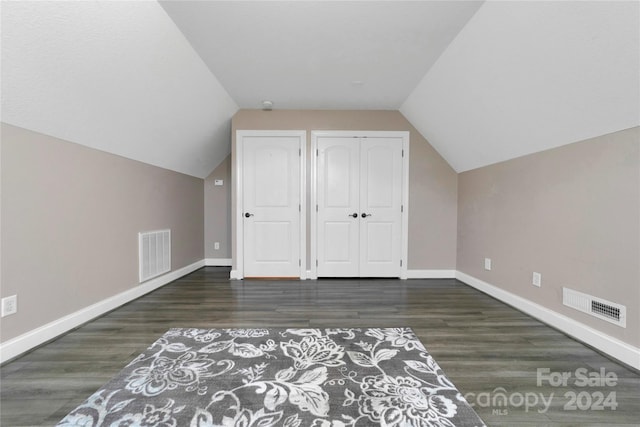 additional living space featuring visible vents, baseboards, and wood finished floors