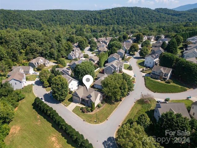 birds eye view of property with a residential view and a forest view