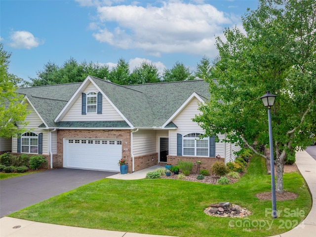 view of front facade with a garage and a front lawn