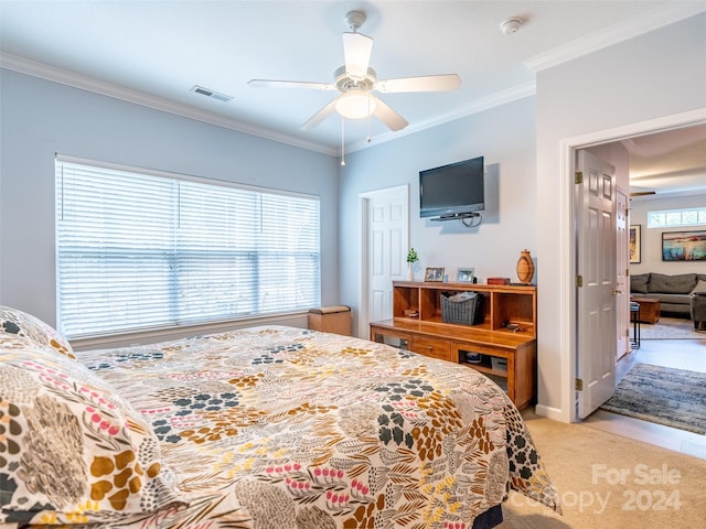 tiled bedroom with ceiling fan, crown molding, and multiple windows