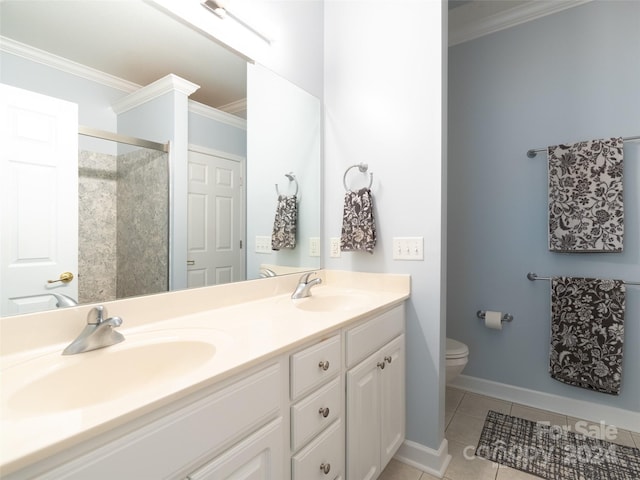 bathroom with tile patterned floors, double sink vanity, crown molding, and toilet