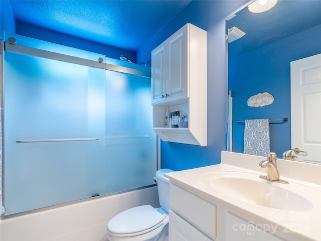 full bathroom featuring toilet, vanity, and enclosed tub / shower combo