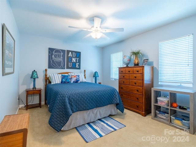 carpeted bedroom featuring ceiling fan