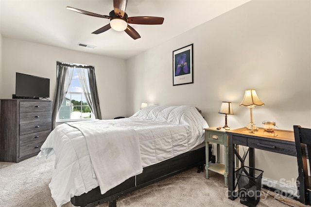 bedroom with carpet flooring, a ceiling fan, and visible vents