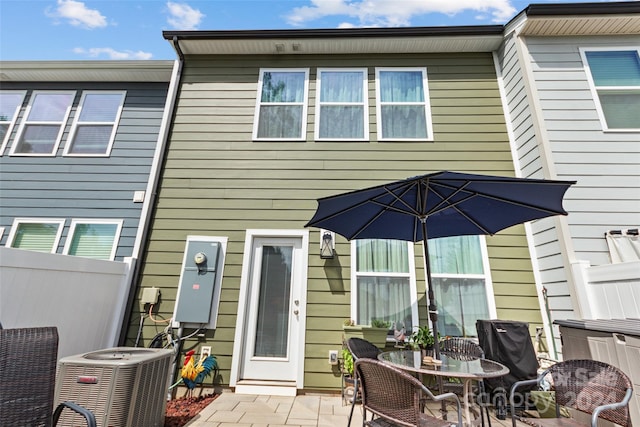 back of house featuring a patio, central AC unit, and fence