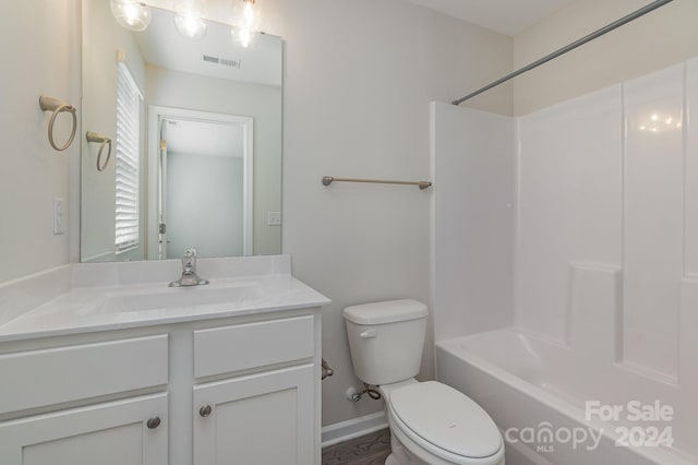 full bathroom with shower / bath combination, vanity, and toilet