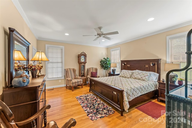 bedroom featuring ceiling fan, light wood-type flooring, and ornamental molding