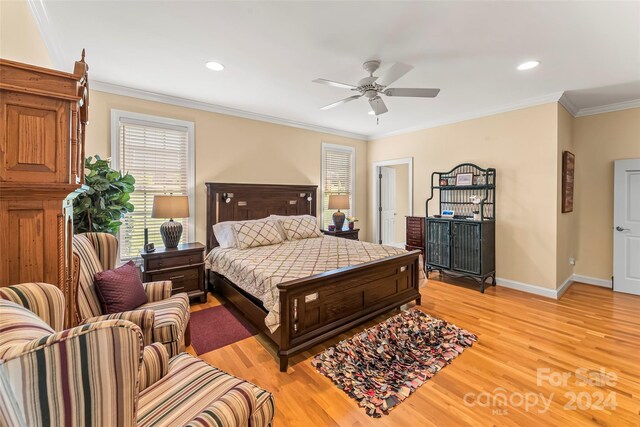 bedroom with ceiling fan, light hardwood / wood-style flooring, and ornamental molding