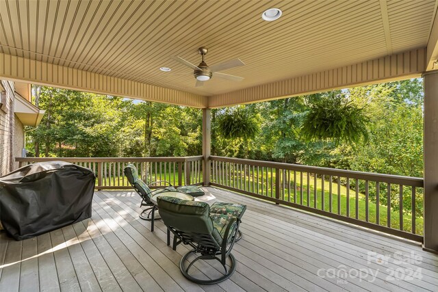 deck with ceiling fan and area for grilling