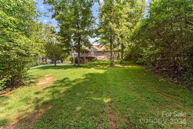 view of yard with a wooden deck