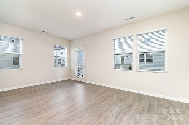 spare room featuring light wood-type flooring