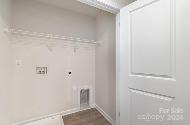 laundry room featuring hookup for an electric dryer, hardwood / wood-style flooring, washer hookup, and gas dryer hookup