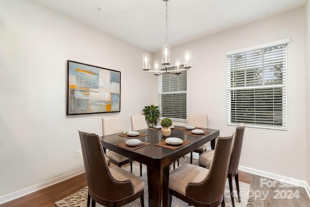 dining room featuring a chandelier and dark hardwood / wood-style flooring